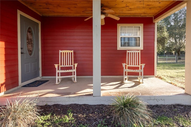 property entrance featuring covered porch and a ceiling fan