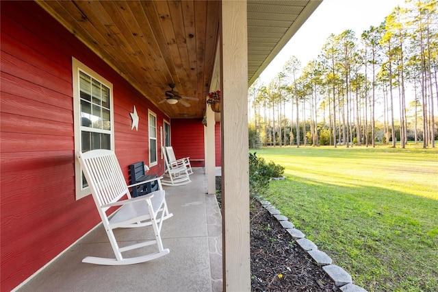 view of patio with ceiling fan and a porch