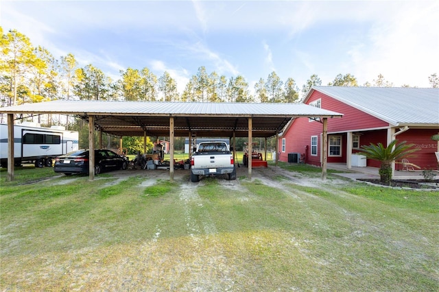 view of parking / parking lot featuring driveway and a detached carport