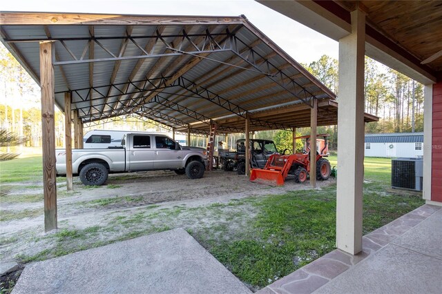 view of parking / parking lot featuring a carport