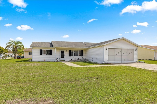 ranch-style house with a garage, a front yard, and driveway