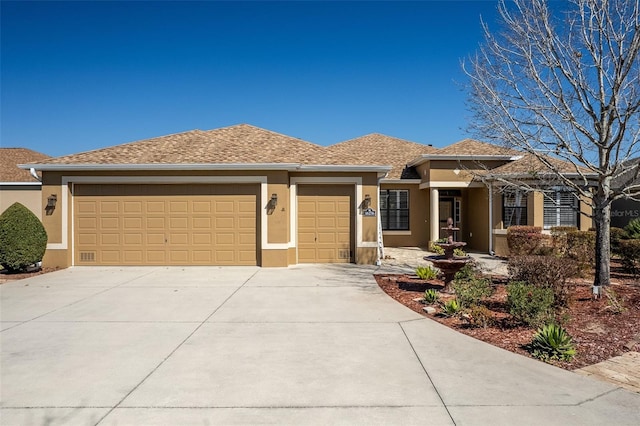 view of front of home with a garage, driveway, a shingled roof, and stucco siding