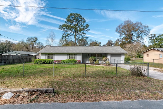 ranch-style house with driveway, a fenced front yard, and a front yard