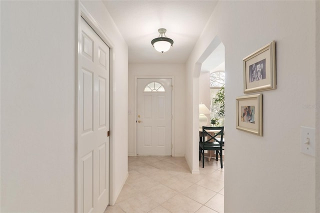 entryway with light tile patterned floors