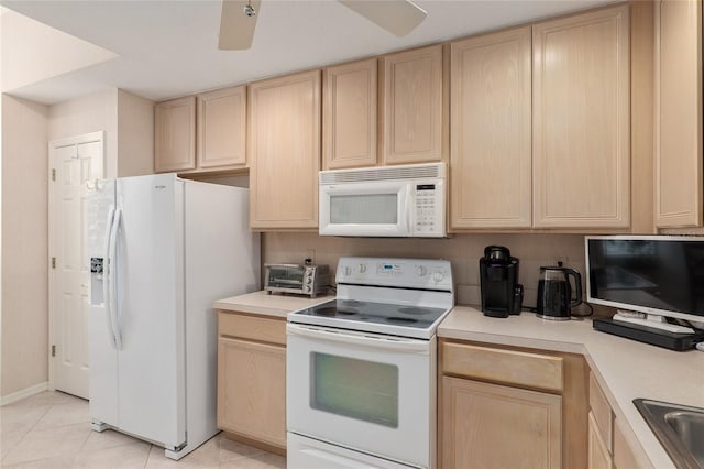 kitchen featuring a ceiling fan, white appliances, light countertops, and light brown cabinets