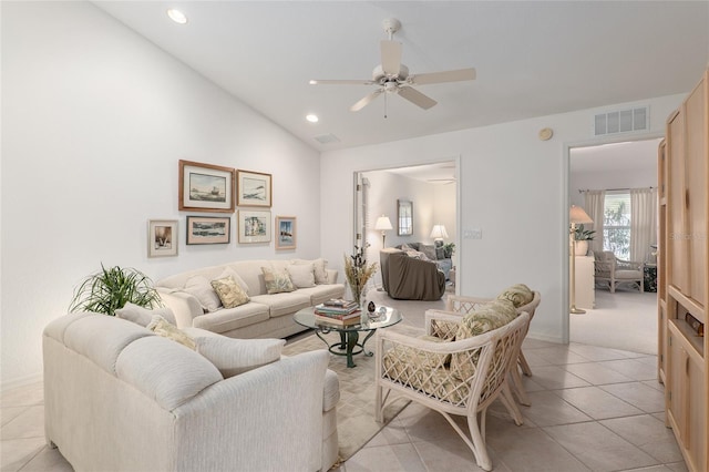 living area featuring light tile patterned floors, visible vents, a ceiling fan, lofted ceiling, and recessed lighting