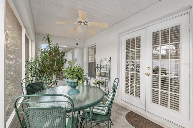 sunroom featuring french doors and ceiling fan