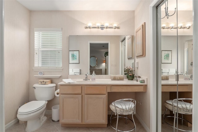 full bathroom with tile patterned flooring, baseboards, vanity, and toilet