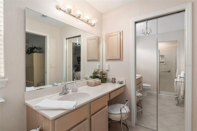 bathroom with tile patterned flooring, visible vents, vanity, and toilet