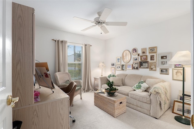 living room featuring a ceiling fan and light colored carpet