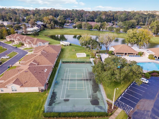 birds eye view of property with a water view and a residential view