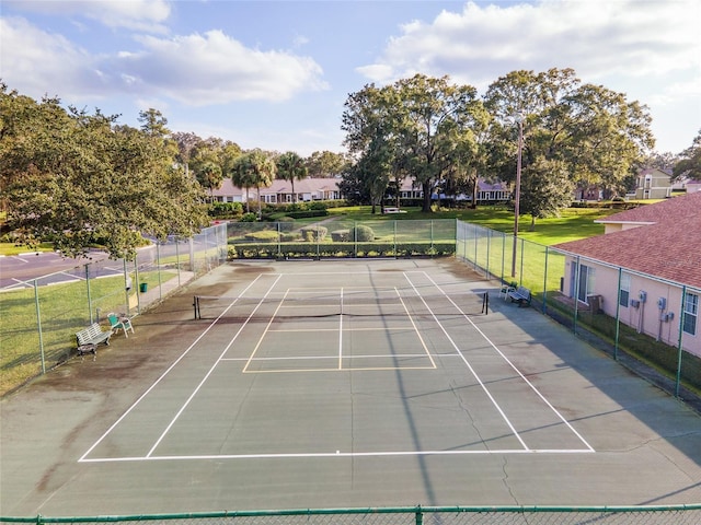 view of sport court with fence