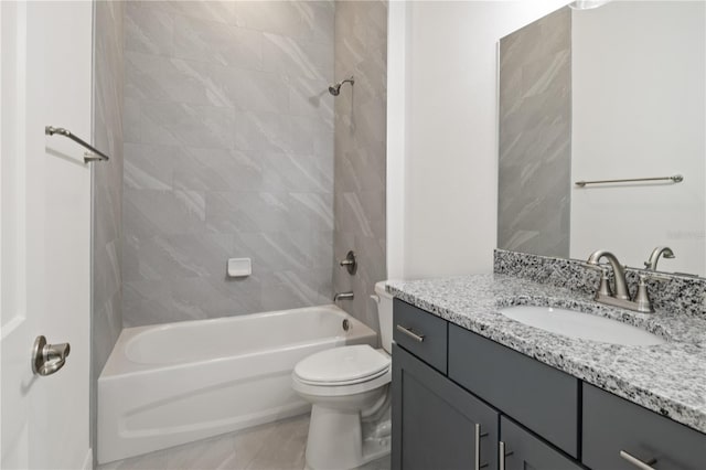full bath featuring vanity, bathtub / shower combination, and toilet