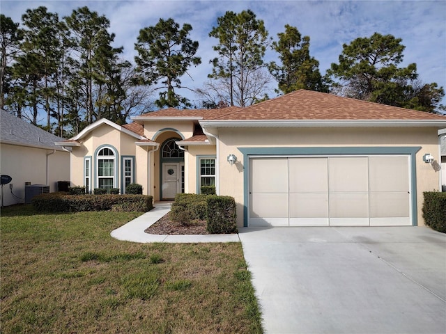 view of front of property with stucco siding, concrete driveway, central AC, a garage, and a front lawn