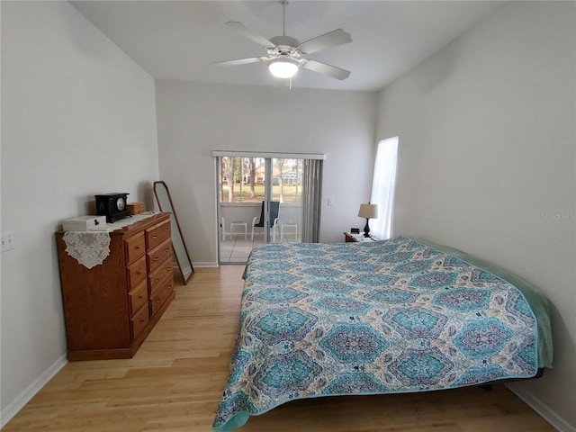 bedroom with light wood-style floors, access to exterior, baseboards, and a ceiling fan