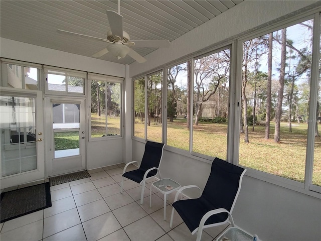 sunroom / solarium with a ceiling fan and plenty of natural light