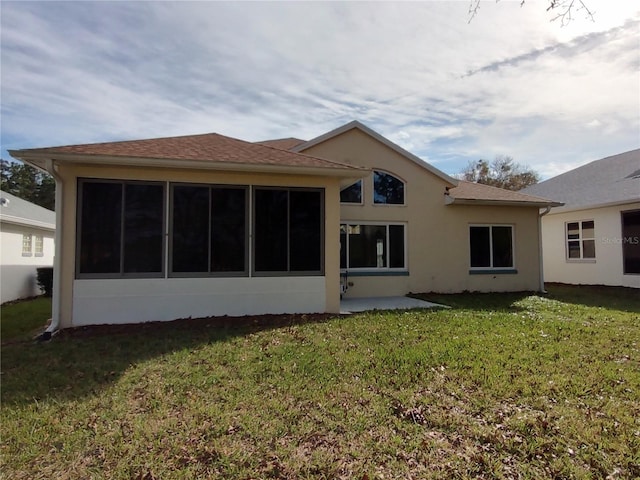 rear view of house with a yard