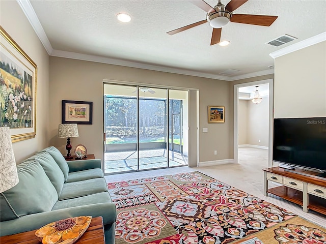 living room featuring ornamental molding, light colored carpet, visible vents, and a textured ceiling