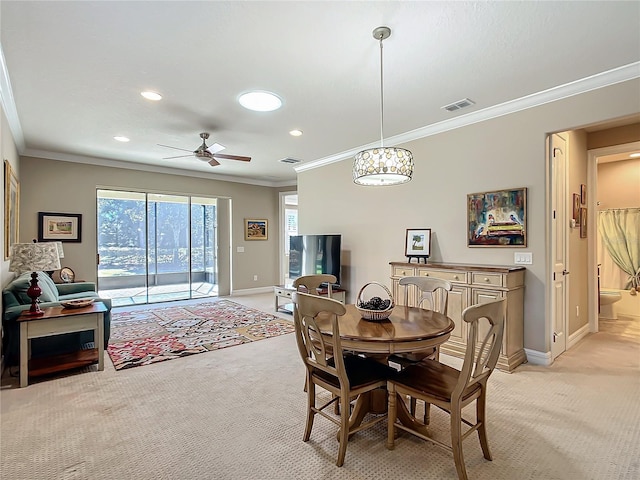 dining area with light carpet, baseboards, and visible vents