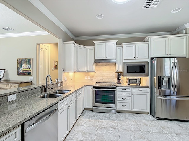 kitchen with visible vents, white cabinets, stainless steel appliances, under cabinet range hood, and a sink