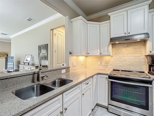 kitchen with under cabinet range hood, a sink, visible vents, white cabinets, and stainless steel range with electric cooktop