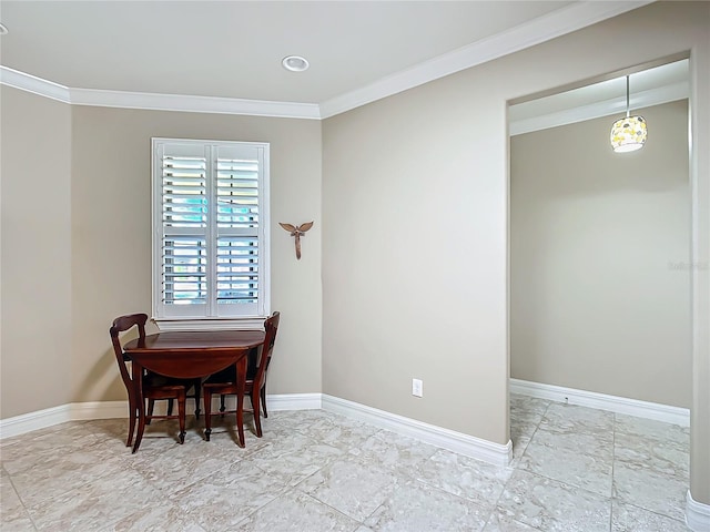 dining area with marble finish floor, baseboards, and crown molding