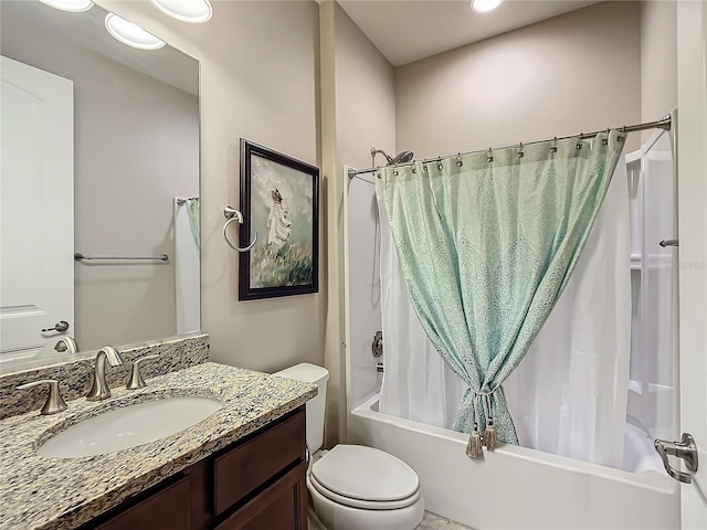 full bath featuring shower / bath combo, vanity, and toilet