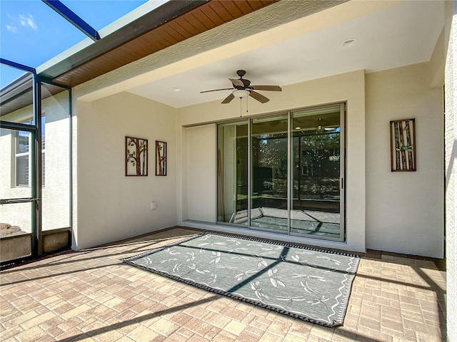 view of patio / terrace featuring ceiling fan