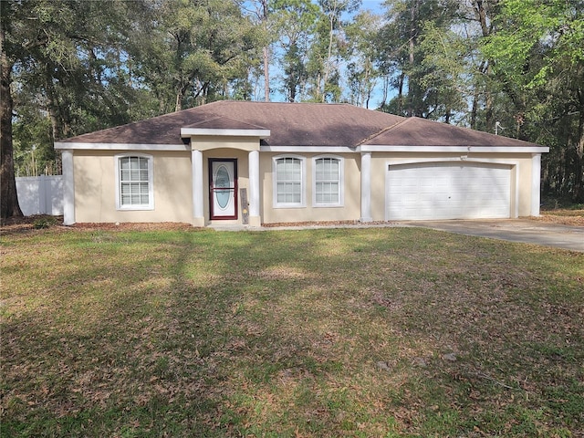 single story home with an attached garage, driveway, a front yard, and stucco siding