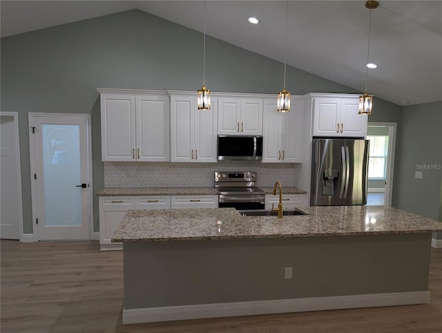 kitchen featuring light wood-style floors, a sink, white cabinetry, and appliances with stainless steel finishes