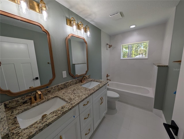 full bathroom featuring double vanity, a sink, toilet, and shower / washtub combination