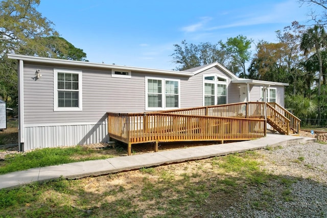 rear view of house with a wooden deck