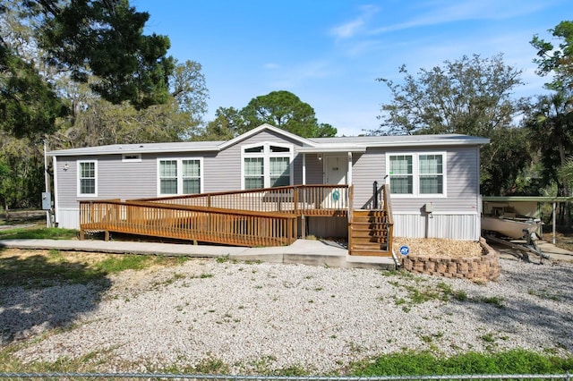 manufactured / mobile home with a wooden deck