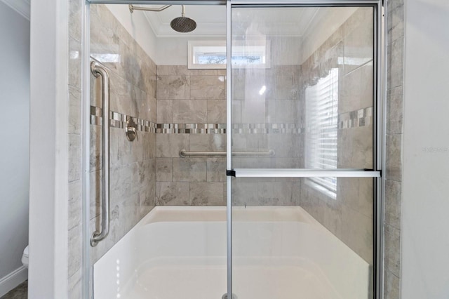 full bathroom with ornamental molding and toilet