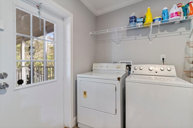 washroom featuring washing machine and dryer, laundry area, and crown molding