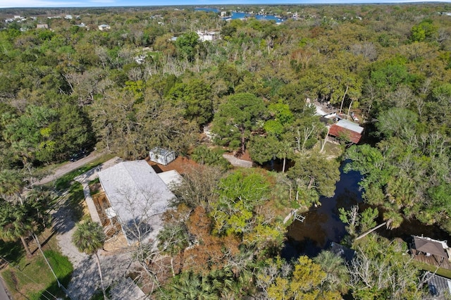 bird's eye view featuring a wooded view