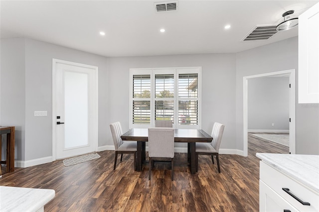 dining room featuring dark wood-style floors, visible vents, and recessed lighting