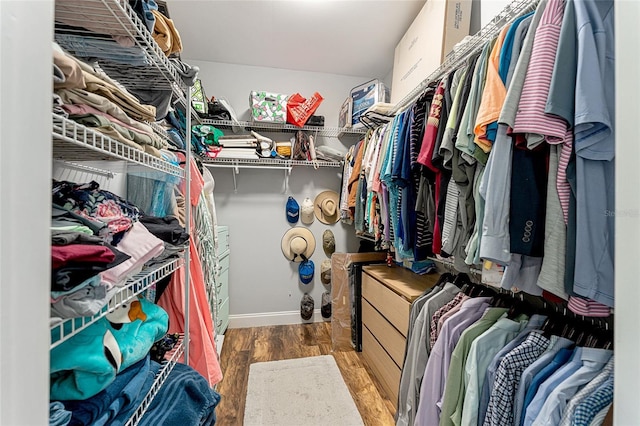 spacious closet with wood finished floors