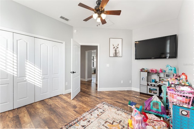 game room featuring a ceiling fan, dark wood finished floors, visible vents, and baseboards