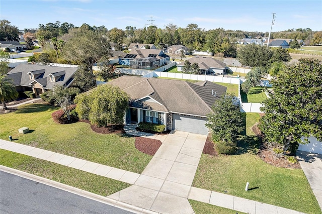 birds eye view of property with a residential view