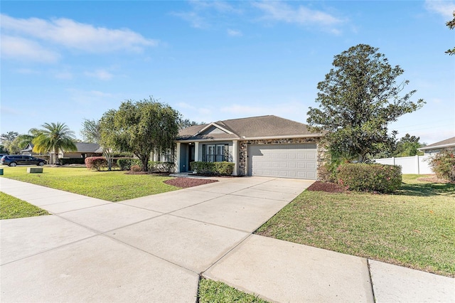 single story home with an attached garage, fence, driveway, stone siding, and a front yard