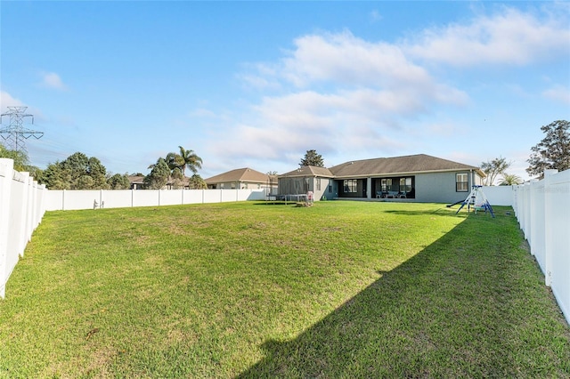 view of yard with a fenced backyard