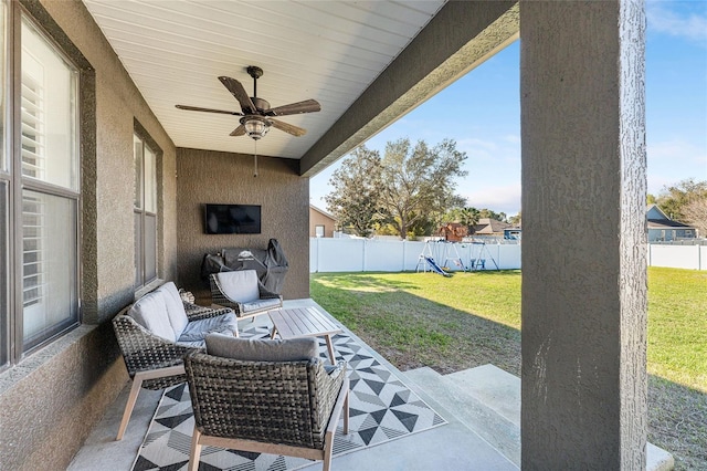 view of patio / terrace with a fenced backyard and a ceiling fan