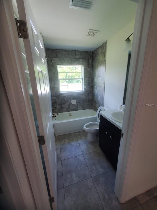 bathroom featuring tub / shower combination, visible vents, vanity, and tile patterned floors