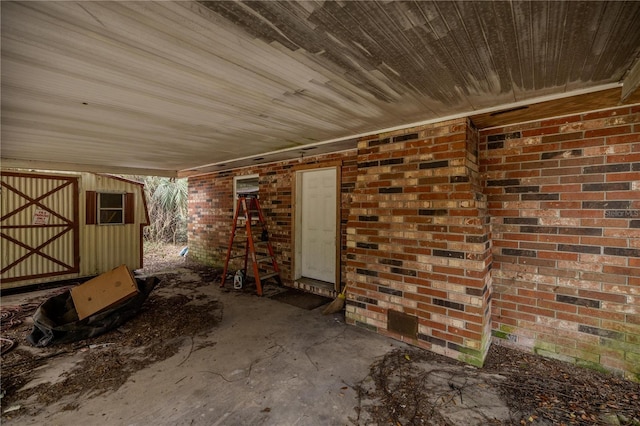 view of patio / terrace featuring a shed and an outdoor structure