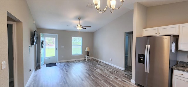 kitchen featuring light wood-style flooring, visible vents, white cabinets, and stainless steel fridge with ice dispenser