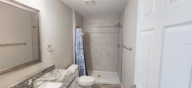 full bath with a stall shower, visible vents, a textured ceiling, and toilet