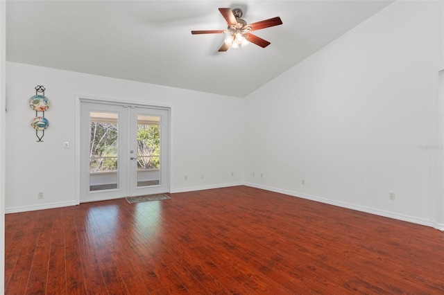 spare room featuring french doors, vaulted ceiling, baseboards, and hardwood / wood-style flooring