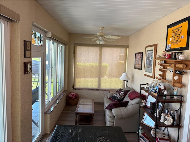 sunroom featuring ceiling fan