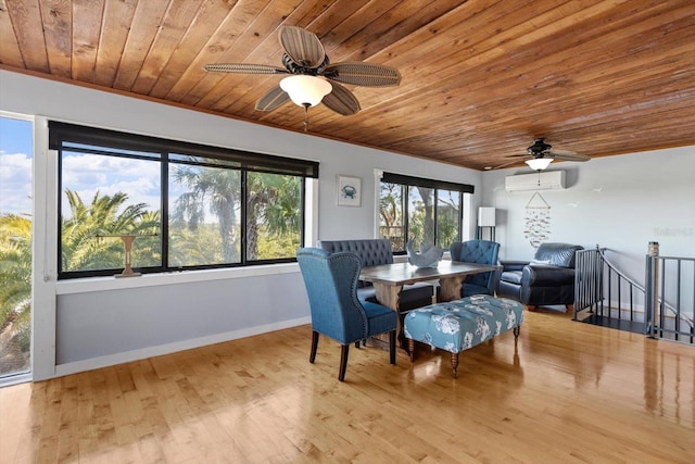 dining room with ceiling fan, a wall unit AC, wood ceiling, baseboards, and light wood-style floors